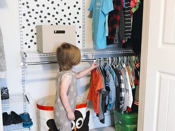 Even boys need organization ... that's why I set out to create this organized shared closet for brothers! Using a DIY closet system, we created a tiny but functional closet for boys who share a room. Click to see more!