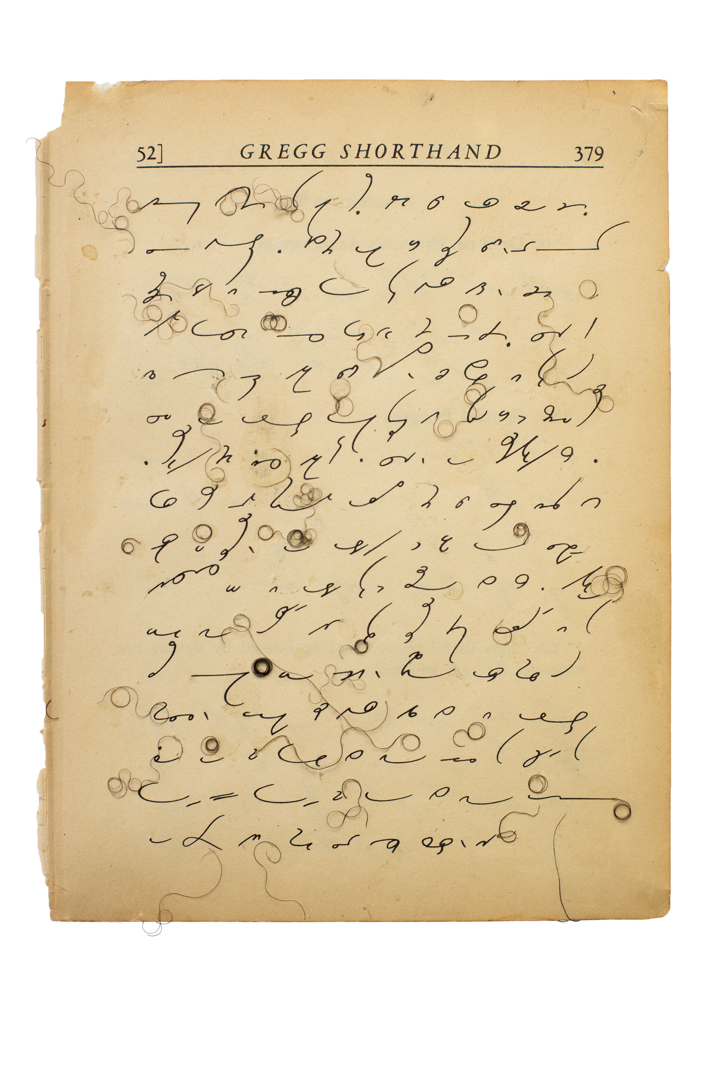 An aged sheet from Gregg Shorthand with curly black hair swirling throughout the shorthand.