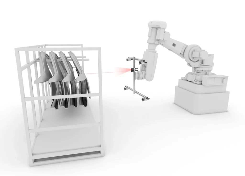 2D vision-guided robotics with integrated distance measurement for removing body parts from load carriers