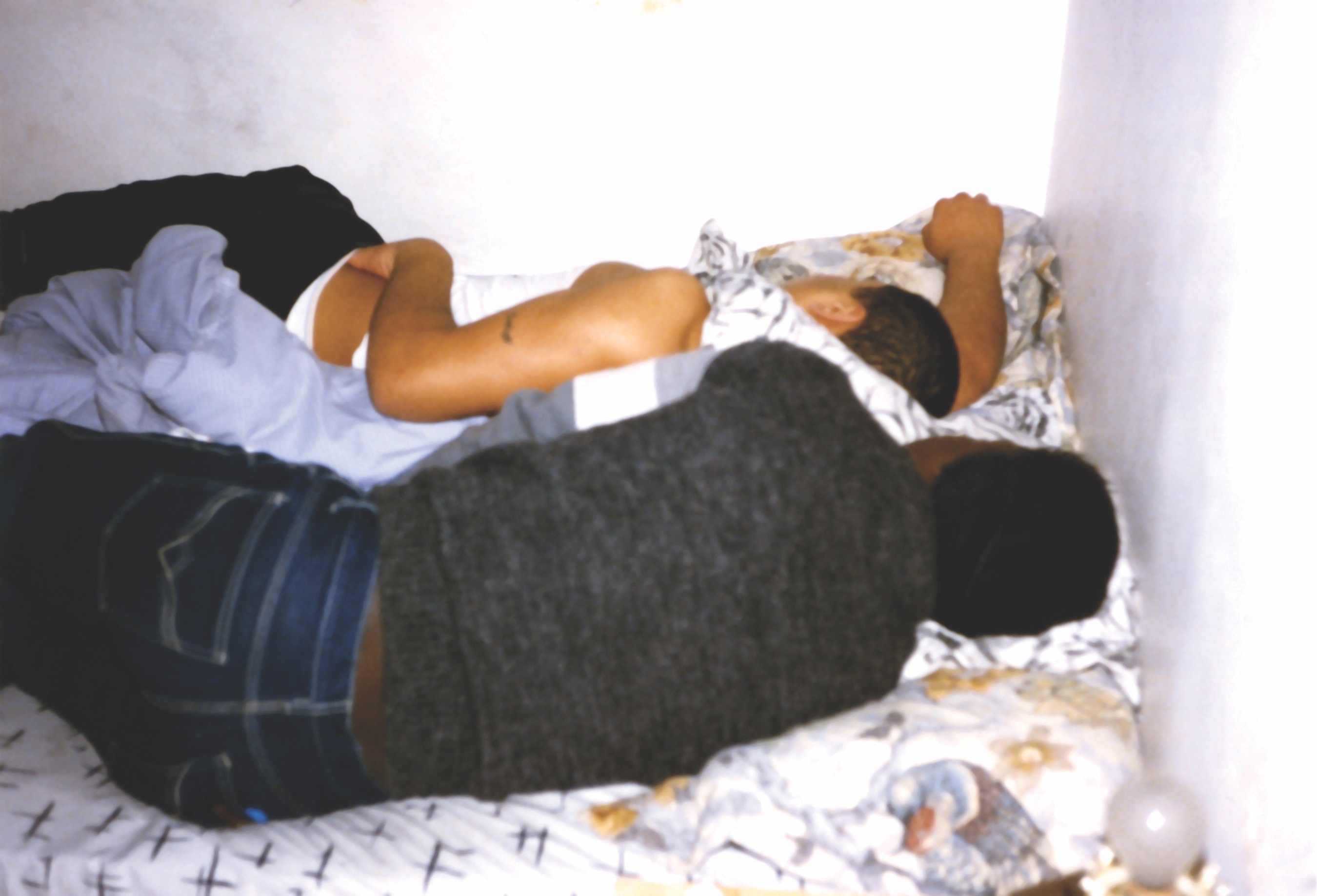 men sleeping in a bed | Archival image #37 from OLI RODRIGUEZ