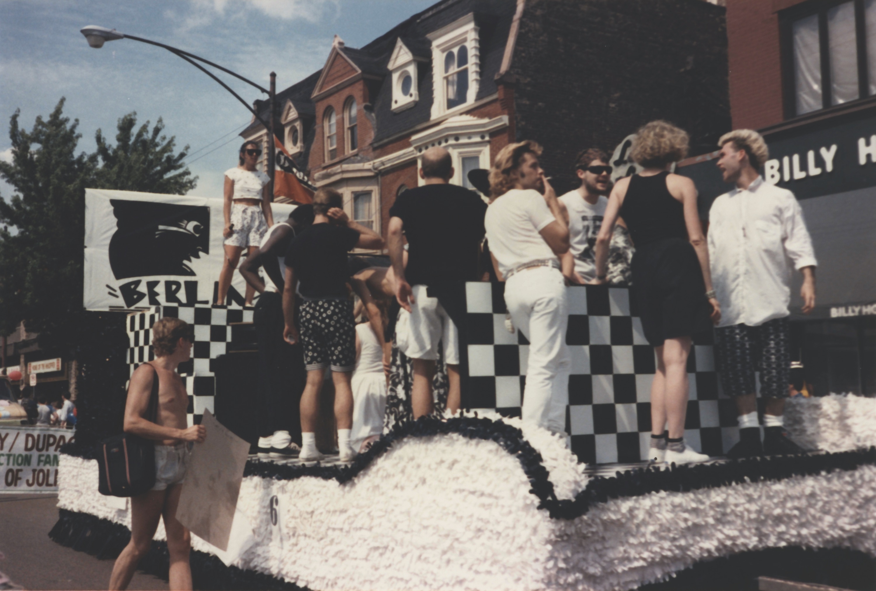people on black and white/checkered float in lakeview, Chicago