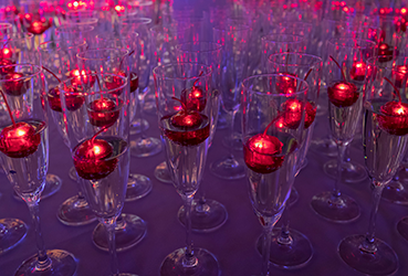 Red candles floating in champaign glasses