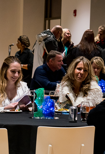 Teachers socializing at a Teacher's Lounge event