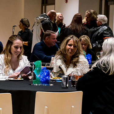 Teachers socializing at a Teacher's Lounge event