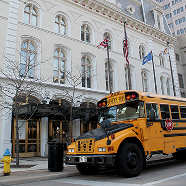 School bus parked in front of Victoria Theatre