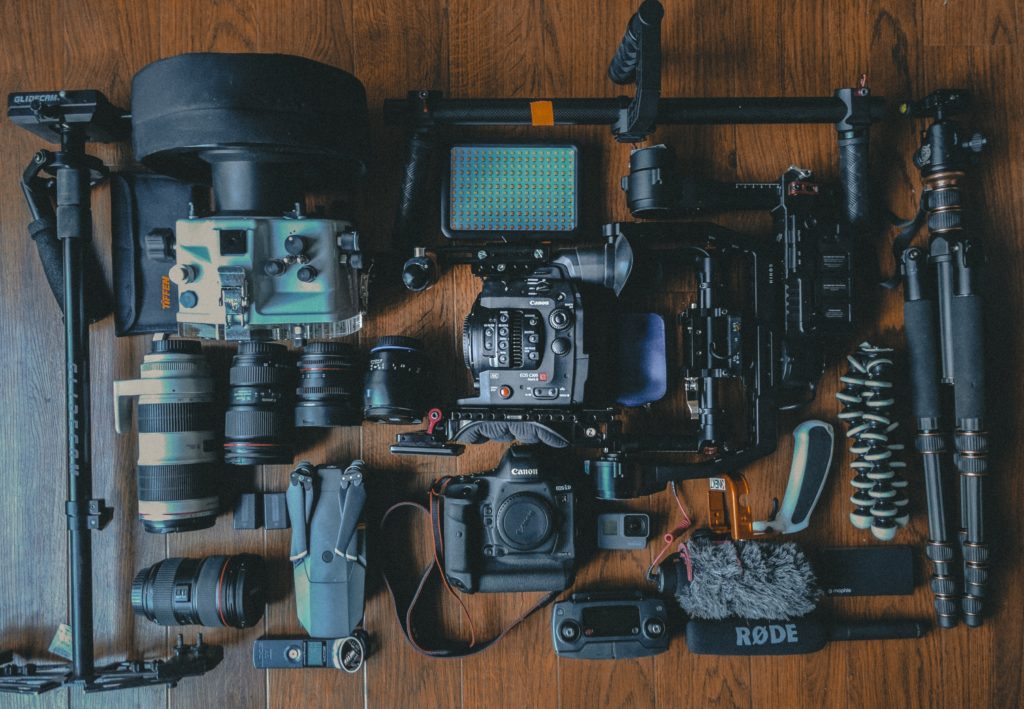 camera photography gear spread out on floor