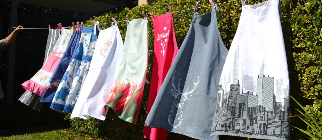 aprons on a clothesline, History of Aprons, apron for women, aprons for men