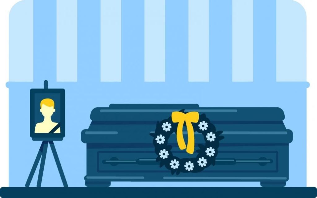 A black coffin with a portrait beside it