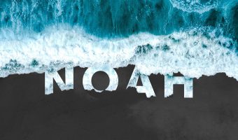 Ocean waves with Noah written on the sand.