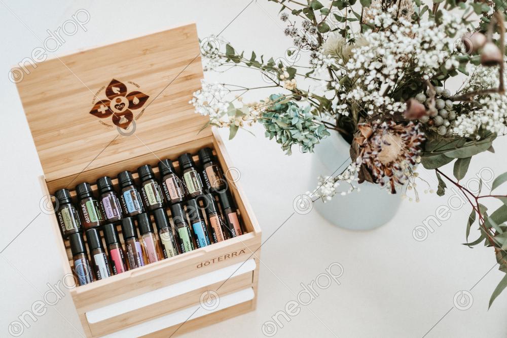 Collection of Essential Oils in Wooden Doterra Box One Drop