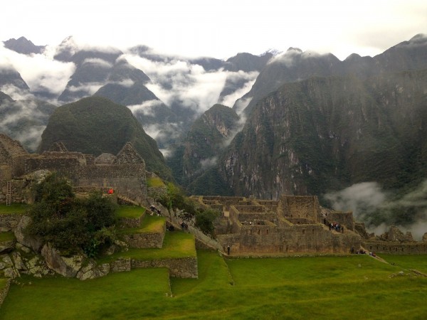 Morning mist rises over Machu Picchu. Photo by Ally Marotti.