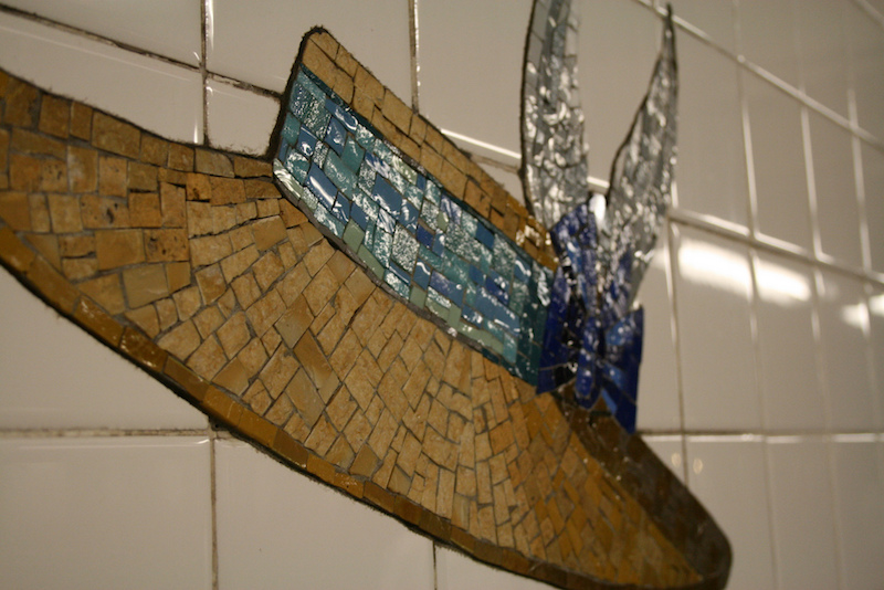 One of the mosaic tile hats at the 23rd street subway station