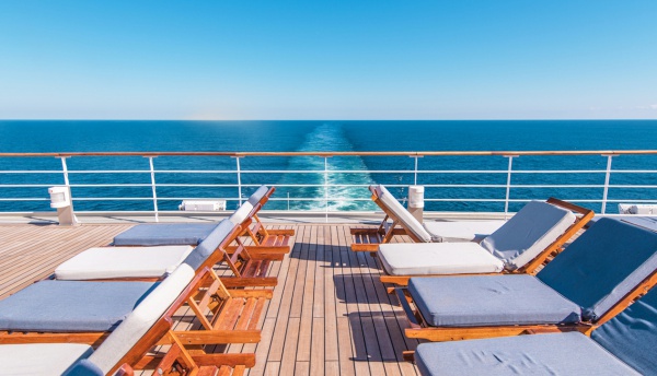 Cruise Ship Vacation. Sea Travel Concept with Deckchairs on the Vessel Deck.