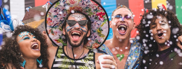 four friends celebrating looking happy
