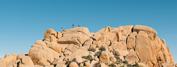 friends hiking on rocks