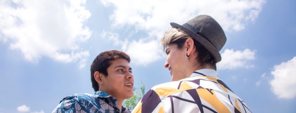 two men smiling at each other