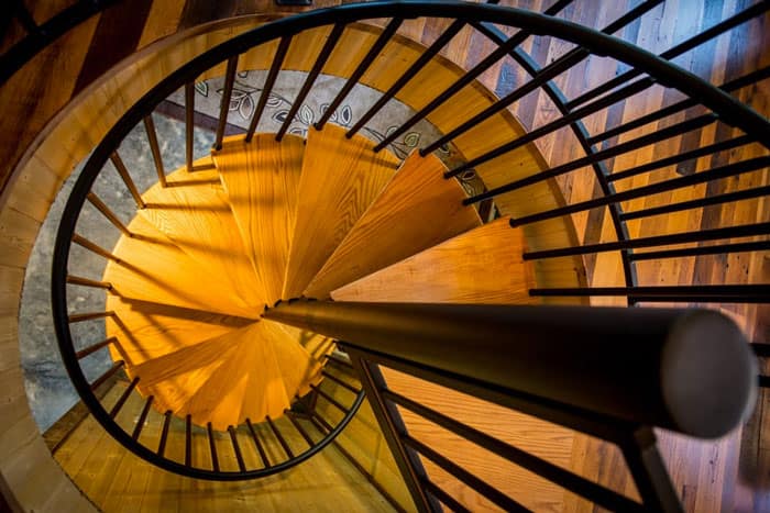 quaint steel spiral staircase with solid wood accents