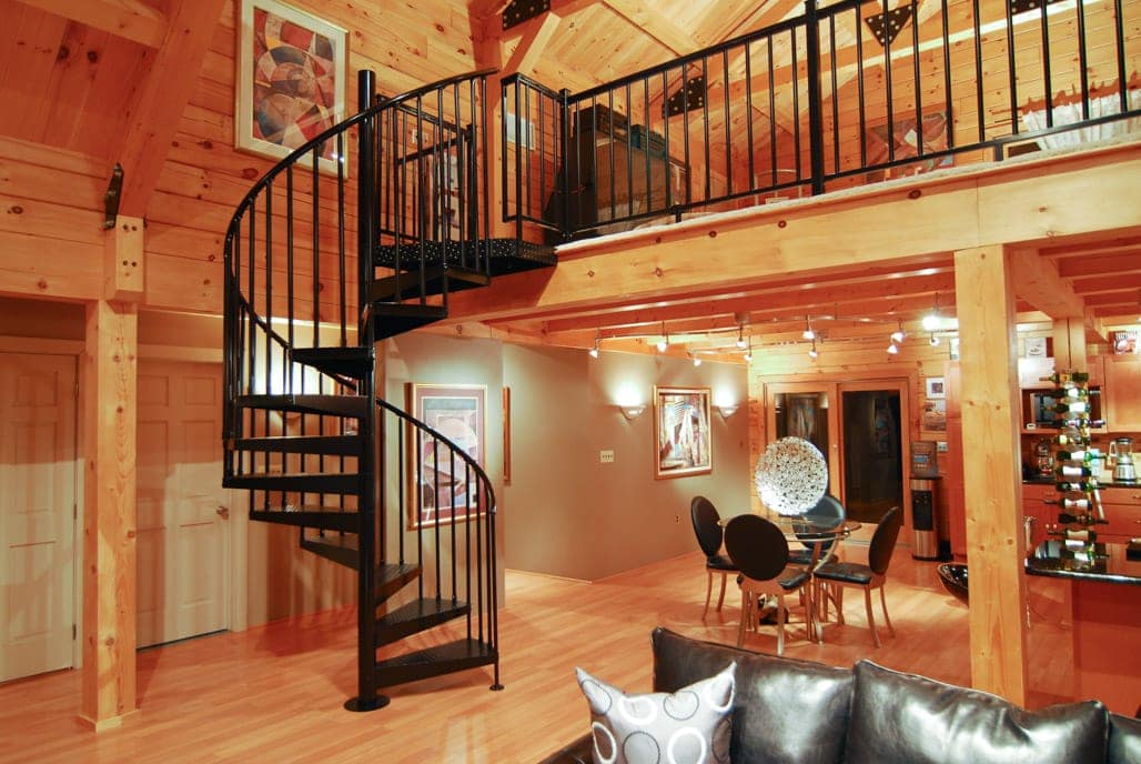 steel spiral stair in all wood cabin