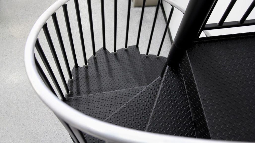 small footprint spiral stair in commercial garage