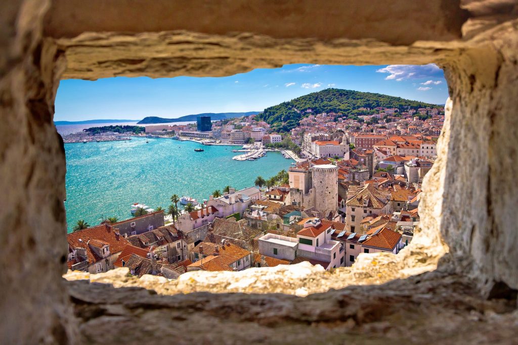 Split bay aerial view through stone window, Dalmatia, Croatia