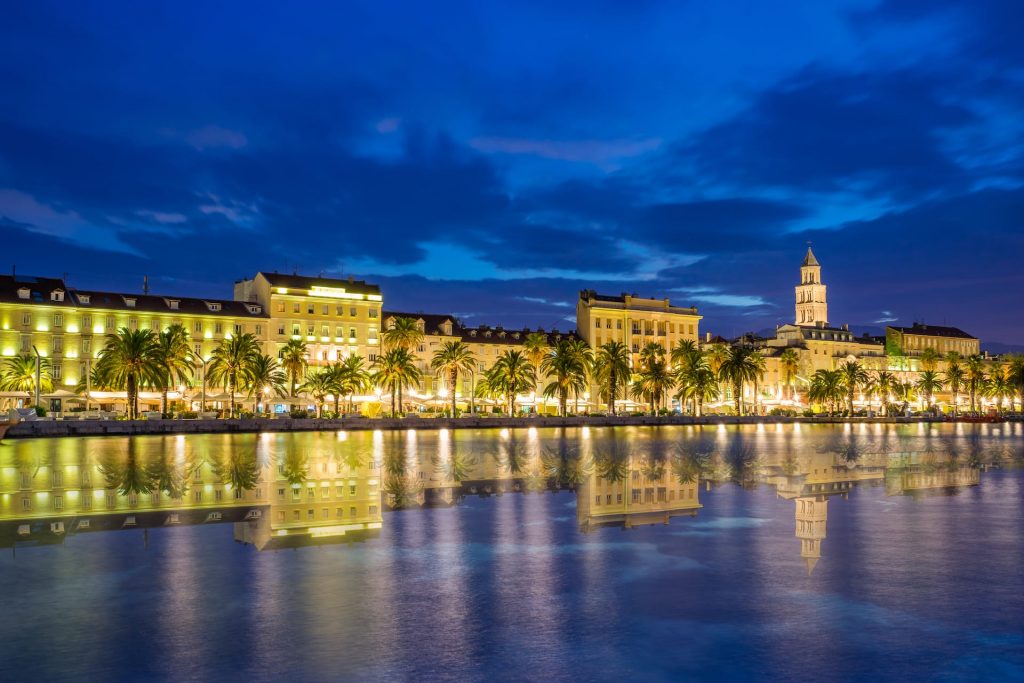Evening viewof Split with Diocletian Palace and St Domnius Cathedral at blue hour with water reflection, Dalmatia, Croatia