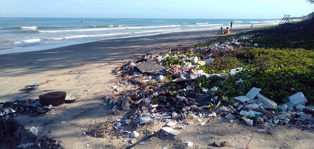 garbage piled up along a shoreline