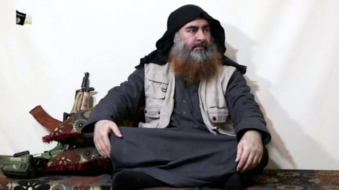 A bearded man with Islamic State leader Abu Bakr al-Baghdadi's appearance speaks in this screen grab taken from video