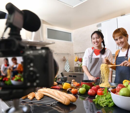 How to Start a YouTube Channel for Cooking Mother and daughter blogger vlogger and online influencer recording video content on healthy food. YouTube channel creation guide.