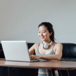Young Asian Woman Working On A Laptop