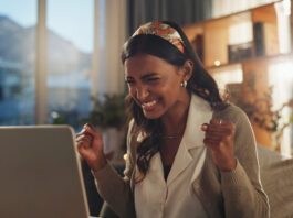 Taja Black Friday Deal Happy woman saving money online with the Taja Black Friday Sale