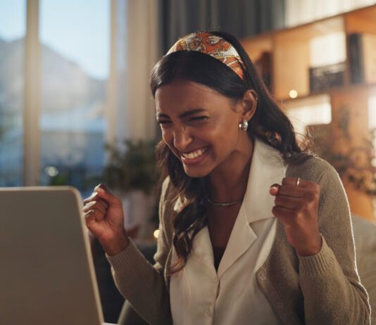 Taja Black Friday Deal Happy woman saving money online with the Taja Black Friday Sale