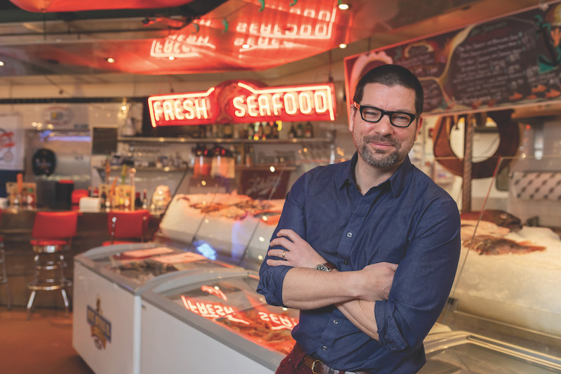 Kyle Cherek poses at the St. Paul Fish Company in Milwaukee's Public Market.