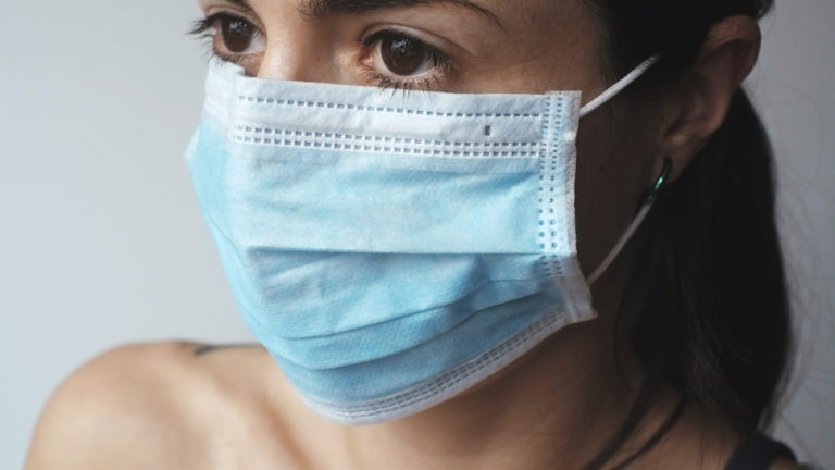 woman in protective hospital mask woman in protective hospital mask