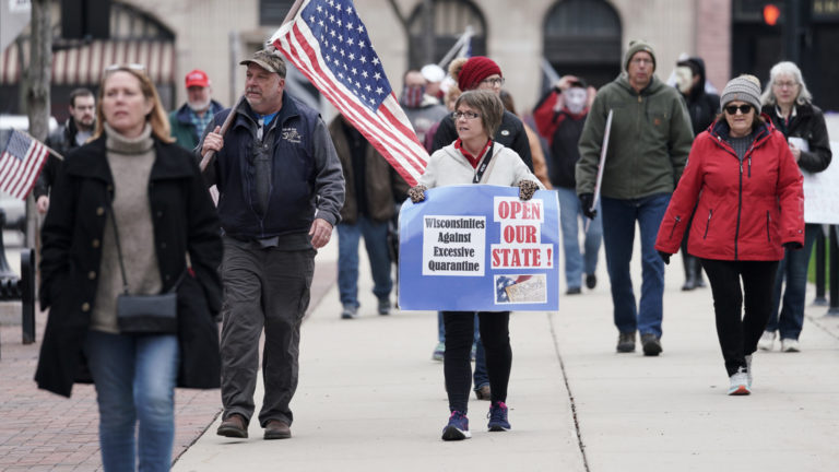 Protesters challenge the governor's Safer at Home order at the state Capitol April 24, 2020. Protesters challenge the governor's Safer at Home order at the state Capitol April 24, 2020.