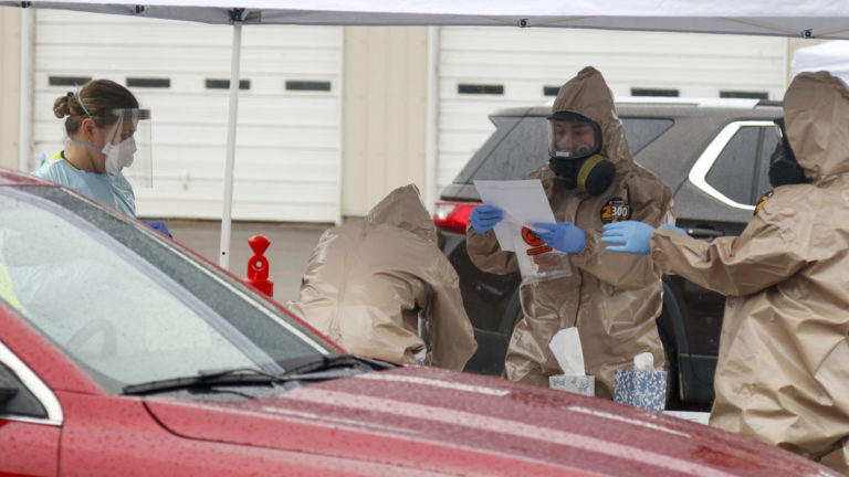 Three Wisconsin National Guard Soldiers and Airmen and one local medical professional help facilitate mobile testing in Buffalo County, Wis., May 1, 2020. Wisconsin National Guard Soldiers and Airmen provide COVID-19 testing alongside county Emergency Management and County Health Officials in support of the Department of Health Services request in Buffalo County, Wisconsin. (Courtesy: Spc. Emma Anderson / Wisconsin National Guard) Three Wisconsin National Guard Soldiers and Airmen and one local medical professional help facilitate mobile testing in Buffalo County, Wis., May 1, 2020. Wisconsin National Guard Soldiers and Airmen provide COVID-19 testing alongside county Emergency Management and County Health Officials in support of the Department of Health Services request in Buffalo County, Wisconsin. (Courtesy: Spc. Emma Anderson / Wisconsin National Guard)