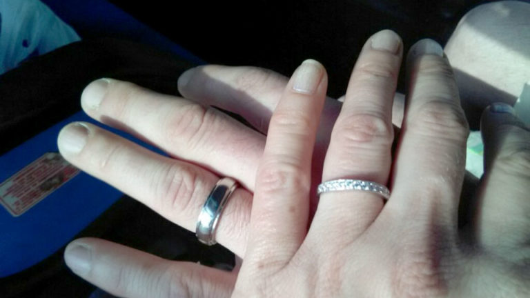 Two hands with wedding rings Two hands with wedding rings