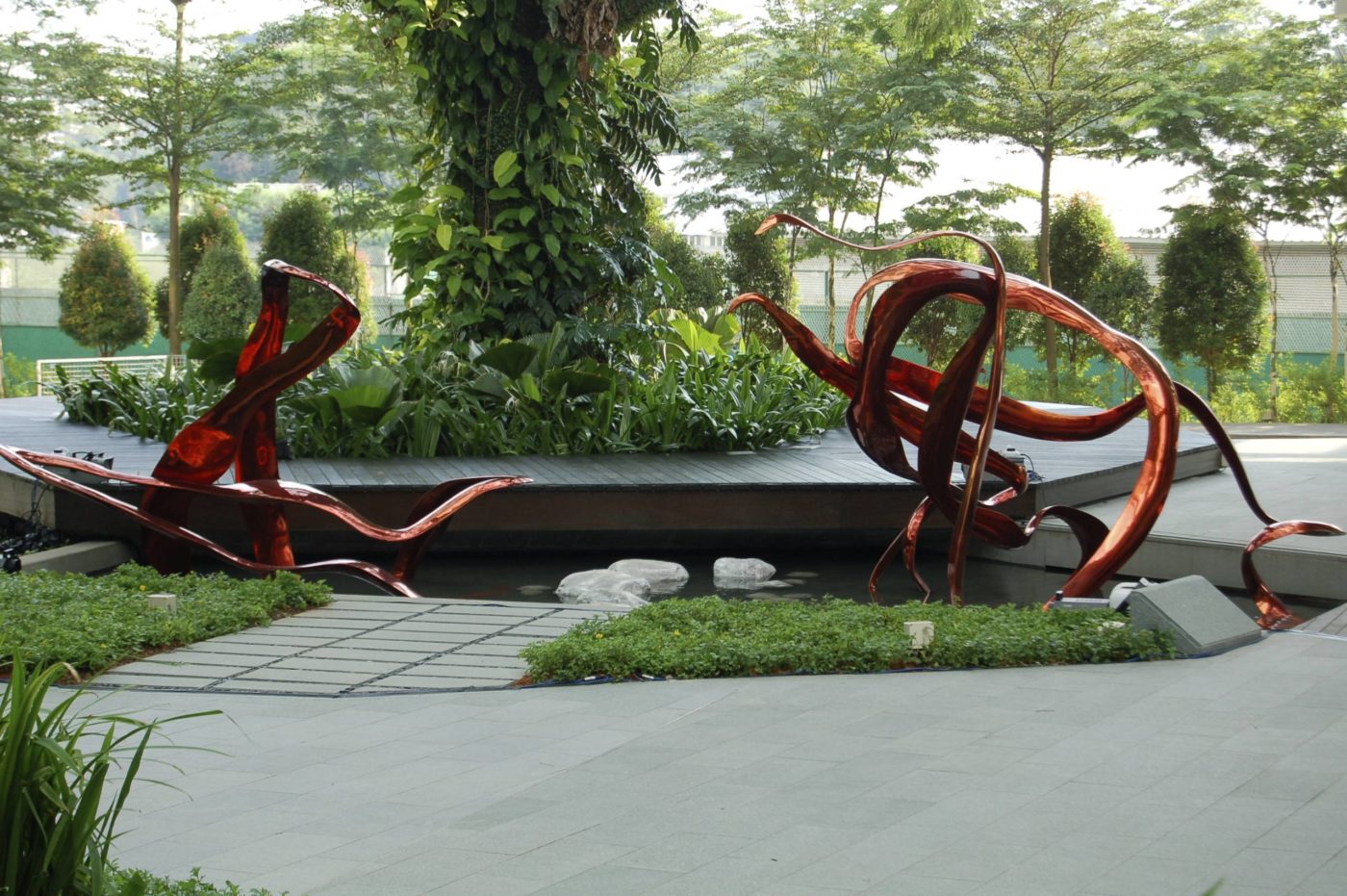"I chose to make a sculpture of the SARS protease because Biopolis Scientists were so excited about their contributions to developing drug candidates for SARS in 2002-2003, a deadly Coronavirus. I chose to create the sculpture in a brilliant red patina over the bronze which adds a flash of color and movement to the plaza."
