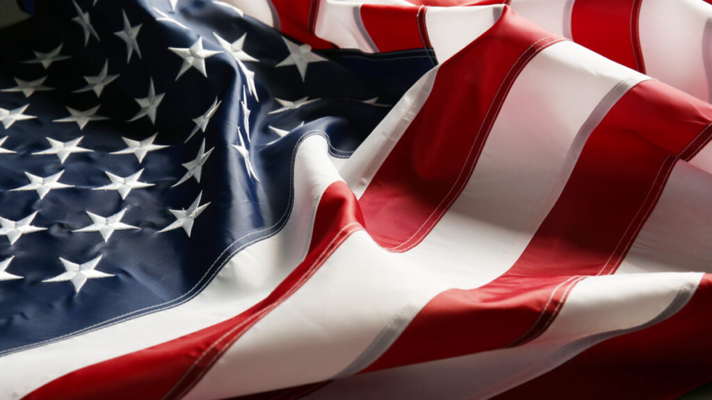 close up of an american flag laid out on a table for veterans day article